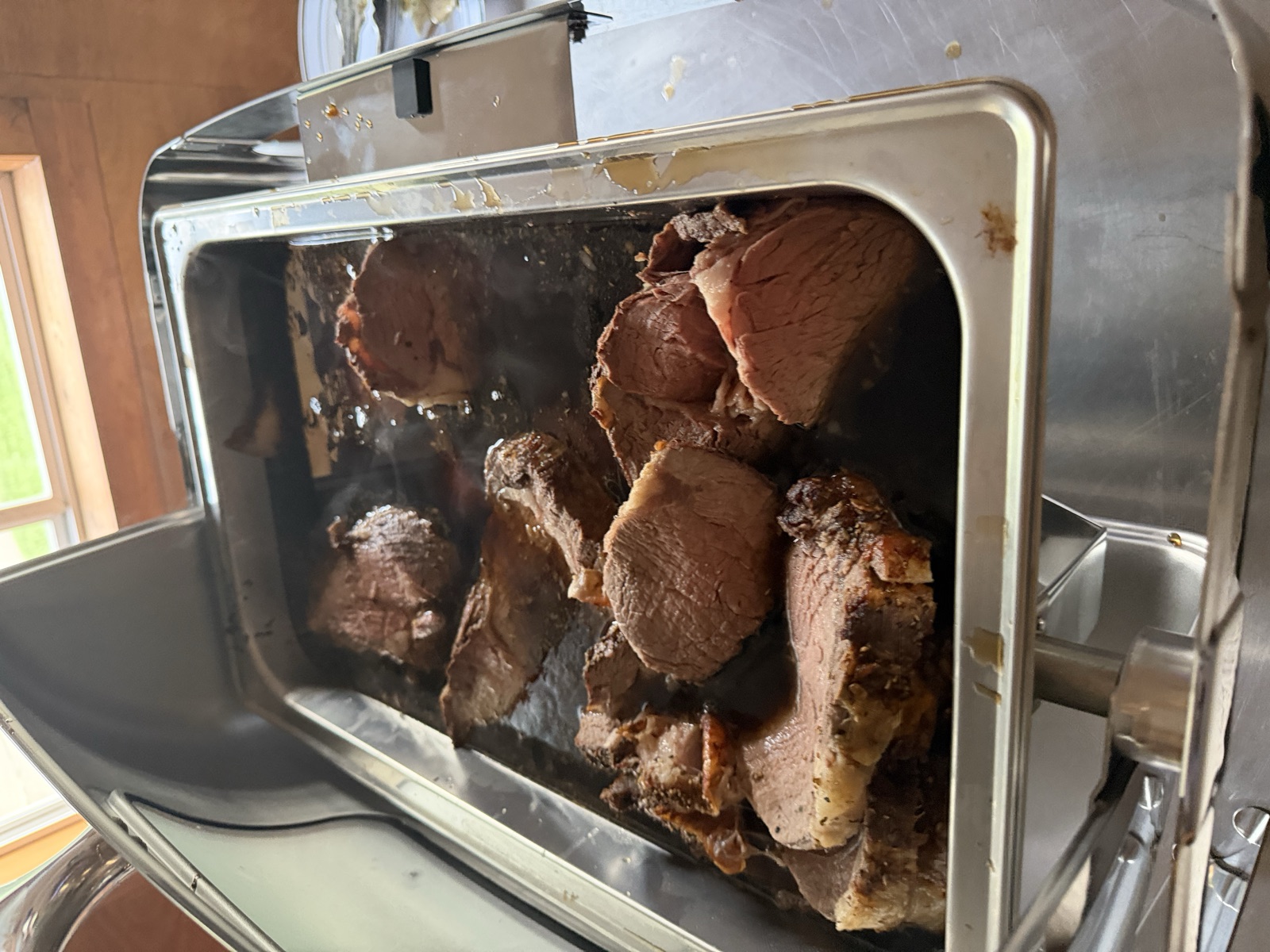 Sliced roast beef in a chafing dish